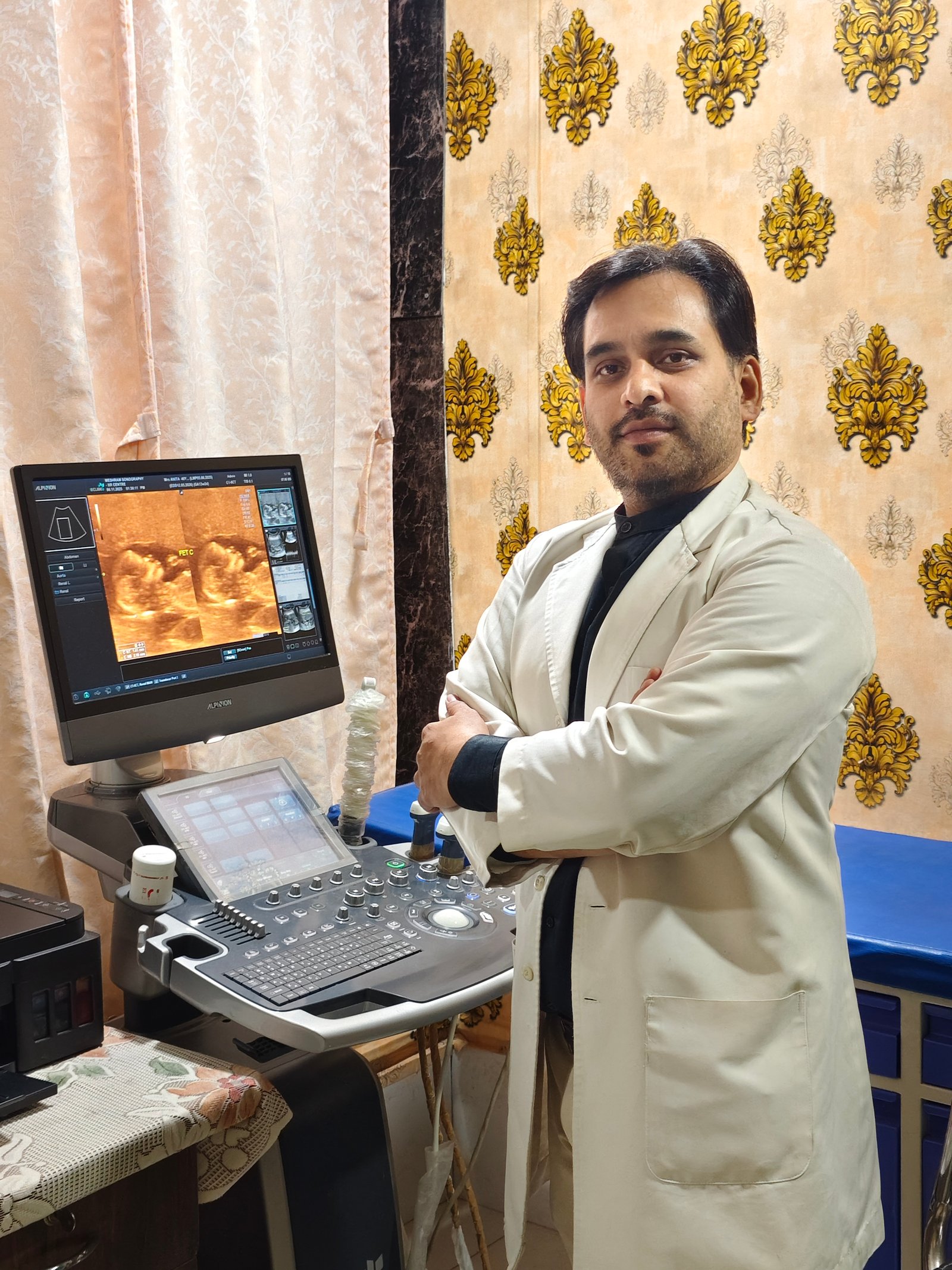 Dr. Manish Meshram performing sonography at Meshram Diagnostics